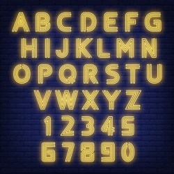 English alphabet neon sign. Glowing letters and figures on dark brick wall background