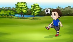 A boy playing soccer outdoor