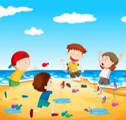 Happy children play balloon fight at the beach