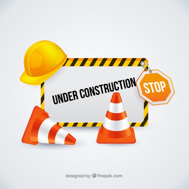 Under construction sign with traffic cones