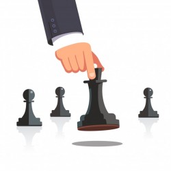 Business man hand making a strategic chess move
