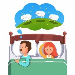 Young couple sleeping in their bed