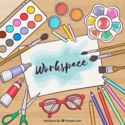 creative workspace with watercolor elements