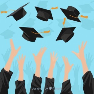 Hands throwing graduation hats in the air