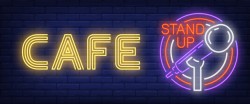Cafe stand up neon sign. glowing bar microphone in circle frame