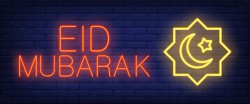 Eid mubarak neon sign. glowing bar lettering and muslim symbol