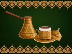 Turkish decorated copper cezve and cup of coffee