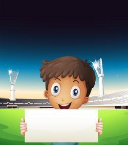 A boy at the stadium holding an empty cardboard