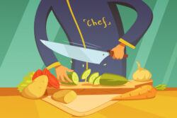 Male chef cutting vegetables